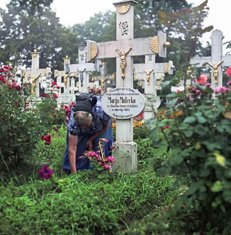 Cultural-historical grave cross and gravestone ensemble in the Sorbian cemetery on the main street in Ralbitz-Rosenthal, Saxony in the territory of the former GDR, German Democratic Republic