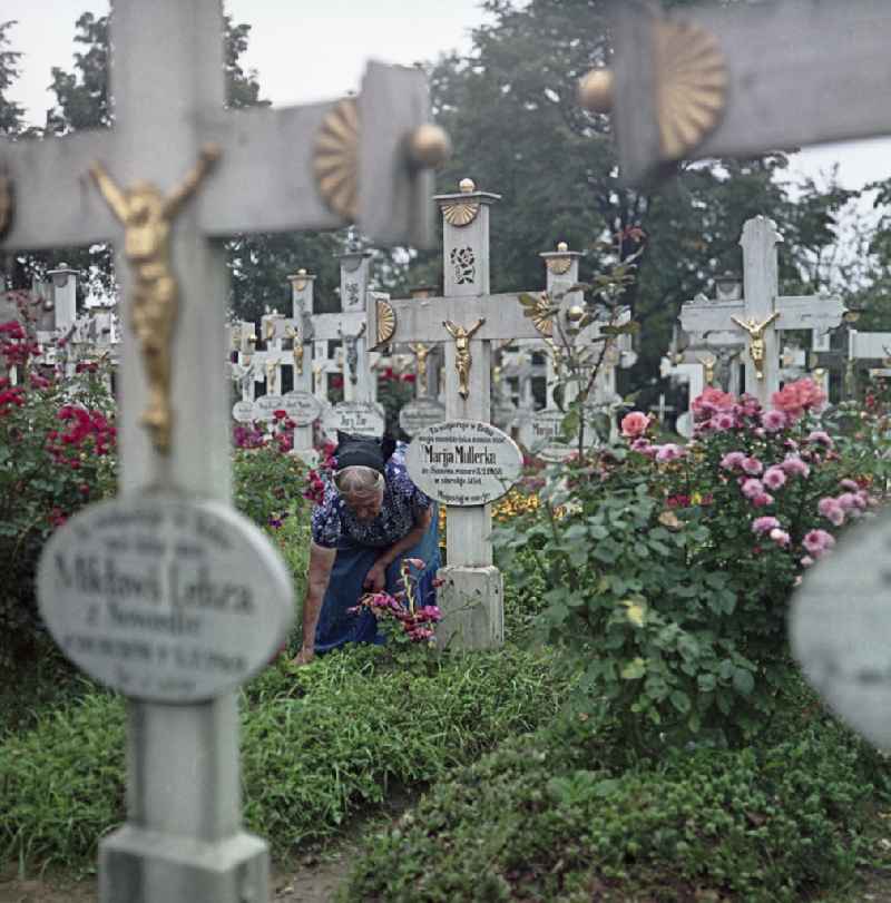 Cultural-historical grave cross and gravestone ensemble in the Sorbian cemetery on the main street in Ralbitz-Rosenthal, Saxony in the territory of the former GDR, German Democratic Republic