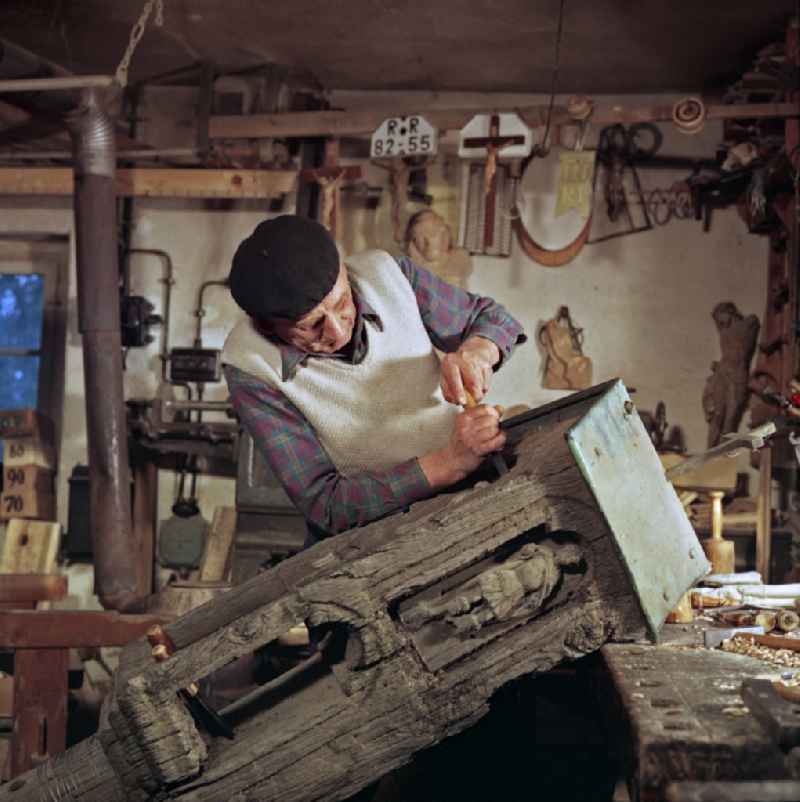 Scene in the film 'Portrait of a Center': Staff of a woodworking craft company restoring Sorbian wood carvings in Raeckelwitz, Saxony in the area of the former GDR, German Democratic Republic