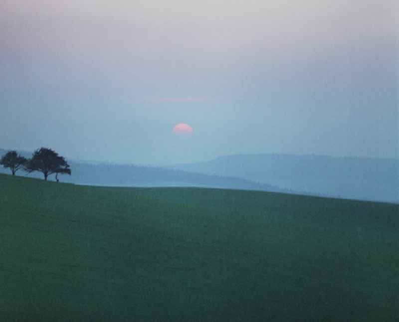 Working photo film 'Portrait of a Center' A sunset on a field near Raeckelwitz, Saxony in the territory of the former GDR, German Democratic Republic