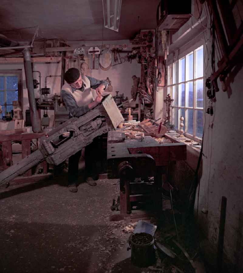 Scene in the film 'Portrait of a Center': Staff of a woodworking craft company restoring Sorbian wood carvings in Raeckelwitz, Saxony in the area of the former GDR, German Democratic Republic