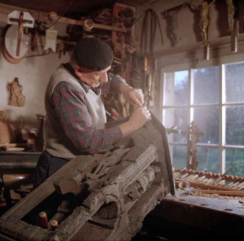 Scene in the film 'Portrait of a Center': Staff of a woodworking craft company restoring Sorbian wood carvings in Raeckelwitz, Saxony in the area of the former GDR, German Democratic Republic