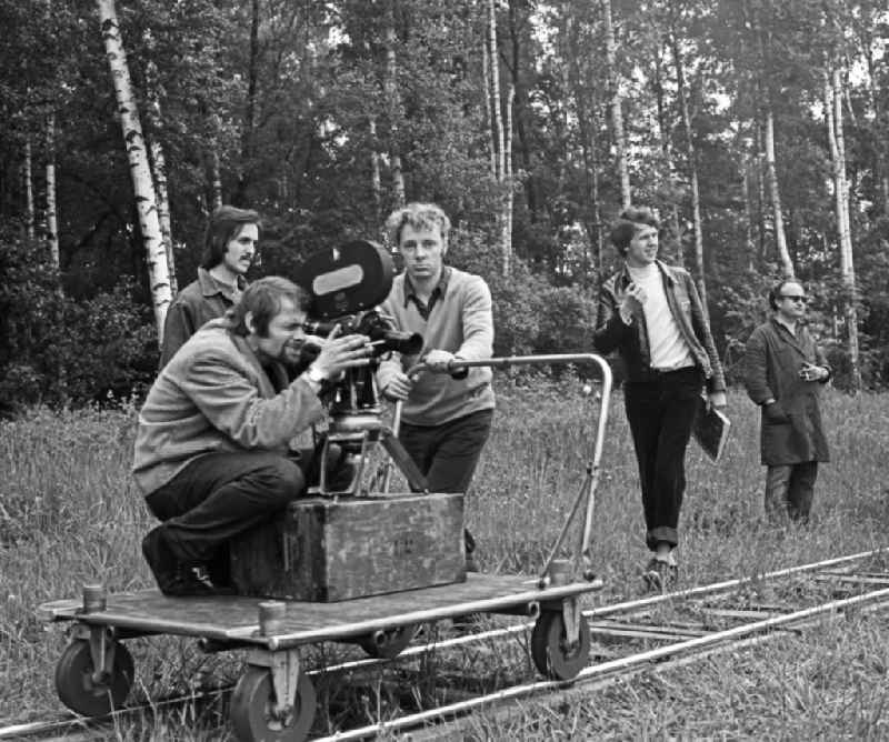 Cameraman Franz Ritschel with director Konrad Herrmann filming on a rail car during recording and filming for 'Struga - Pictures of a Landscape' on the road Fluss Schleife in Schleife, Saxony in the territory of the former GDR, German Democratic Republic