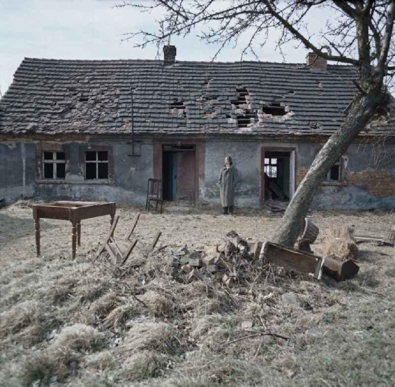 Scene from the film and television production Rublak - The Legend of the Surveyed Land Waste Landscape in Lusatia - the actor Christian Grashof at the destroyed entrance of a cleared farmhouse in Spremberg in the GDR