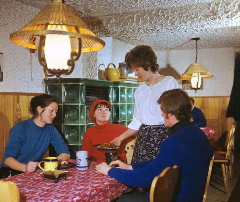 Guests having lunch in a Thuringian specialty restaurant in Steinbach-Hallenberg, Thuringia in the territory of the former GDR, German Democratic Republic