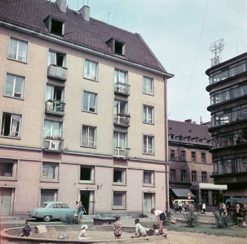 Playground in front of the facade of an apartment building in Wroclaw - Breslau in Poland