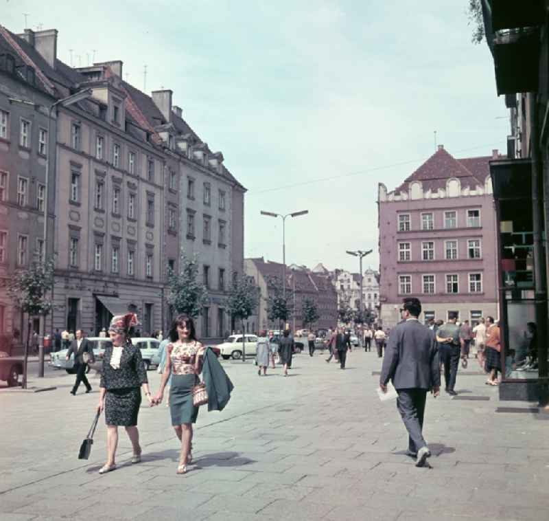 Fashion and clothing of street passers-by on the market square on street Krawiecka in Wroclaw - Breslau in Poland