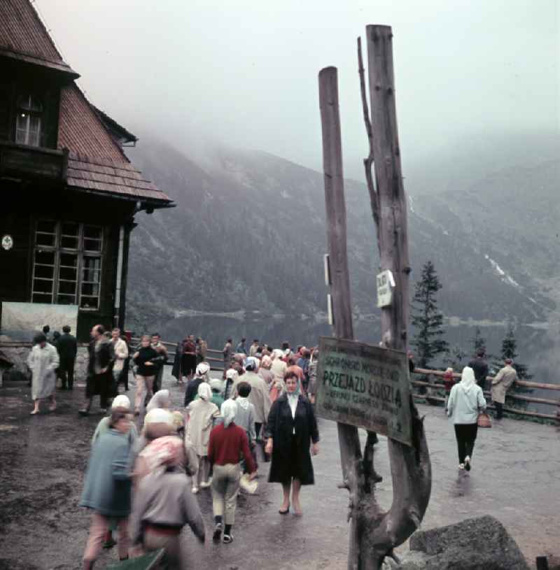 Holidaymakers on an observation deck in the High Tatras at the mountain lake Morskie Oko 'Sea Eye' in Zakopane in Poland